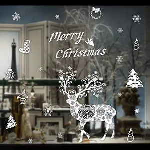Detail van witte kerstmis rendier en sneeuwvlok statische raamstickers op glas