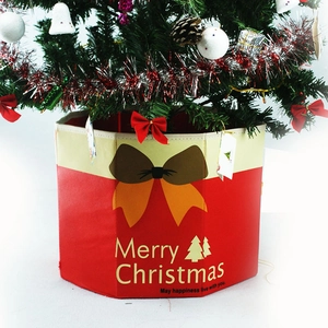 Hexagonal red and white Christmas tree collar with a festive bow and Merry Christmas text