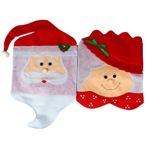 Detail of red Santa Claus and Mrs. Claus felt chair covers for Christmas dining decor