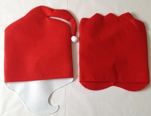 Detail of Santa hat and jagged edge red non-woven fabric chair covers for Christmas decor