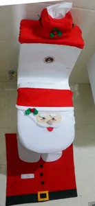 Detail of red Santa toilet seat cover with plush tissue box lid and U-shaped bath rug