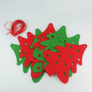 Detail of red and green felt Christmas tree banners with ribbon for DIY party decor