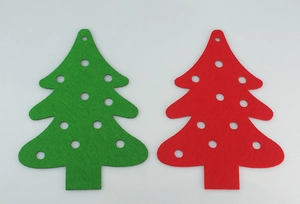 Flat lay of red and green felt Christmas tree banners with decorative cutouts