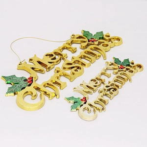 Golden 3D Merry Christmas letter pendants with holly leaves and red berry decorations