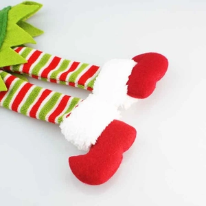 Christmas elf leg wine bottle covers made of festive red and green striped knit fabric