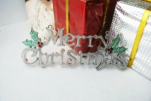 Silver Merry Christmas hanging sign with green leaves and red berries on festive background