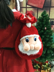 Plush Christmas gift bag featuring a 3D Santa Claus face with white beard and red velvet