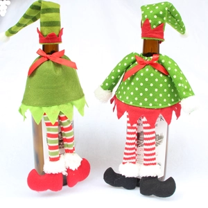 Detailed view of Christmas elf wine bottle covers with felt hats and striped legs