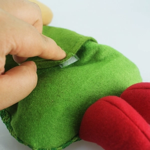 Close-up of the hook and loop fastener on the fabric Christmas doll candy gift bag