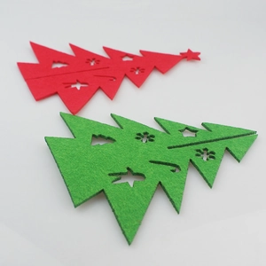 DIY felt Christmas tree tabletop decorations in red and green with cutout star patterns