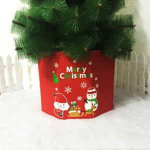 Detail of red Merry Christmas tree skirt collar with Santa Claus and reindeer graphics