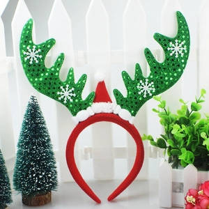 Christmas reindeer antler headband with green sequins and small red hat for holiday party