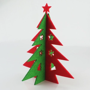 Detail of DIY 3D felt Christmas tree ornament with red and green cutout star patterns