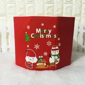Red felt Christmas tree collar with Santa and snowman patterns and Merry Christmas text