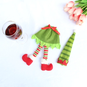 Detailed view of green elf wine bottle outfit with striped legs and matching pointy hat