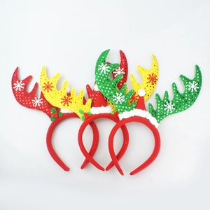 Three sequined Christmas reindeer antler headbands with mini hats on white background