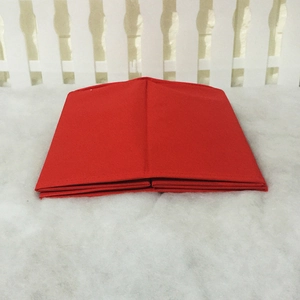 Close-up of red felt Christmas tree collar with high-density stitching and folded texture