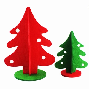 Detail of DIY 3D felt Christmas trees in red and green with minimalist cutout design