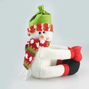 Plush Christmas snowman decoration with green hat and red scarf for festive home tabletop