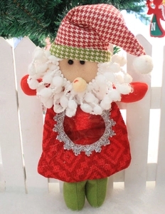 Detail of Santa Claus gift bag with transparent PVC window and festive red fabric texture