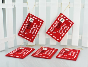 Detail of five red felt Christmas envelope ornaments with gold strings for Santa Claus