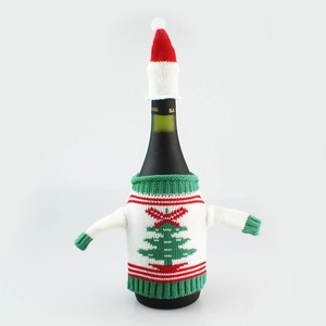 Knitted Christmas tree wine bottle cover with red and white pompom hat for festive decor