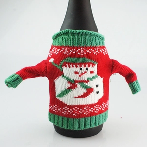 Detail of Christmas wine bottle cover with knitted snowman sweater and sleeve design