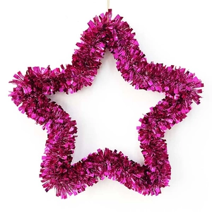Close-up of a decorative 35cm star-shaped wreath in shiny magenta metallic tinsel finish