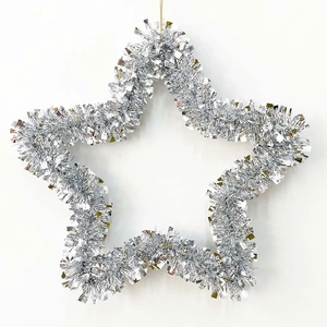 Close-up of a silver tinsel star wreath with sparkling metallic finish for Christmas decor