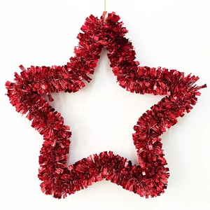 Red tinsel star wreath with hanging gold cord for festive Christmas home door decoration