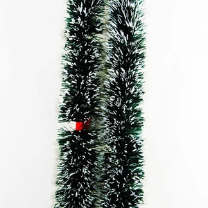 Dark green Christmas tinsel garland with white snow-tipped effect for festive tree decoration