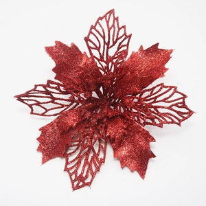 Detail van rode kerststerbloem met glitterblaadjes en ingewikkeld gaas-uitgesneden ontwerp
