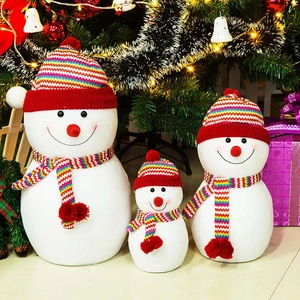 Three snowman Christmas window ornaments set with red striped hats and scarves