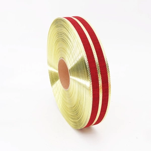 Roll of 5cm gold and red striped linen ribbon for festive Christmas gift wrapping