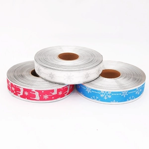 Christmas tree ribbons set with deer and snowflake prints in red white and blue