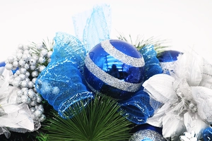 Detail of blue glitter ornaments and silver berries on 40cm Christmas wreath