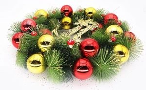 Close-up of 40cm green Christmas wreath with gold red balls and Merry Christmas sign