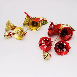 Detail of Christmas reindeer bells with silk bows and artificial pine needles set