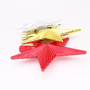 Detailed view of 14.5cm Christmas tree star toppers in red, gold, and silver metallic finishes