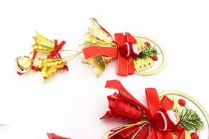Detail of 27cm Christmas tree ornament with Santa doll, red bow, and festive bell