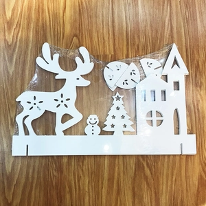 DIY white Christmas tabletop set with deer, house and tree in plastic packaging