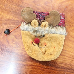 Detail of plush reindeer Christmas gift bag with faux fur collar and 3D antlers