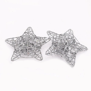 Detail view of two silver glittered star ornaments with hollow mesh wire structure
