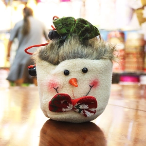 Handmade plush snowman Christmas drawstring gift bag with festive bow and bell decoration