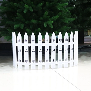 White plastic Christmas tree fence featuring black reindeer and snowflake pattern details