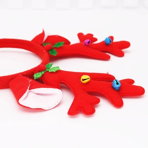 Festive red Christmas reindeer antler headband with colorful bells and holly leaves