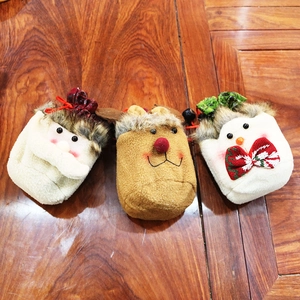 Detailed view of handmade Christmas gift bags with Santa, Reindeer and Snowman patterns