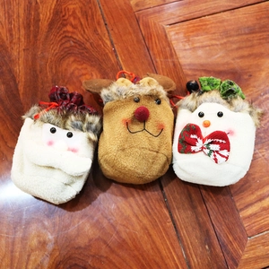Detailed view of handmade Christmas drawstring gift bags with Santa, Elk and Snowman