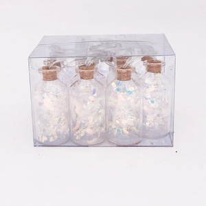 Detail of LED glass bottle string lights with cork stoppers and colorful laser filler