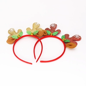 Detail of Christmas reindeer headbands with glitter antlers, bells and plaid patterns